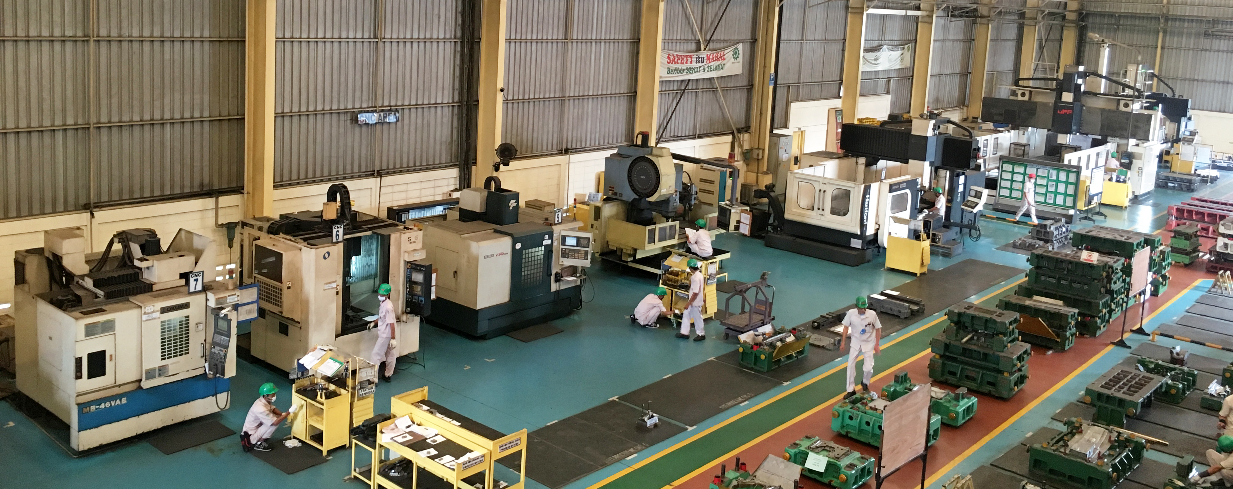 Clean CNC production floor with modern machining centers